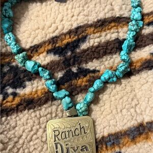 Turquoise Necklace with Silver buckle style pendant.